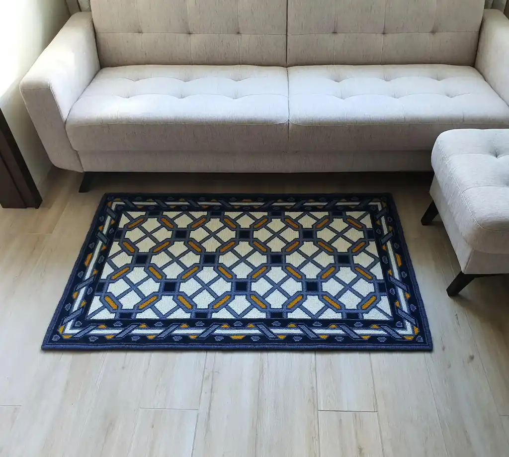 handcrafted wool rug with cross-stitch pattern.