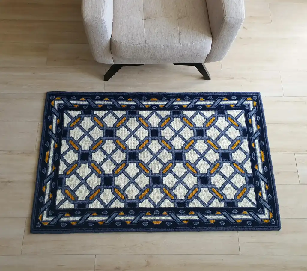 handcrafted wool rug with cross-stitch pattern.