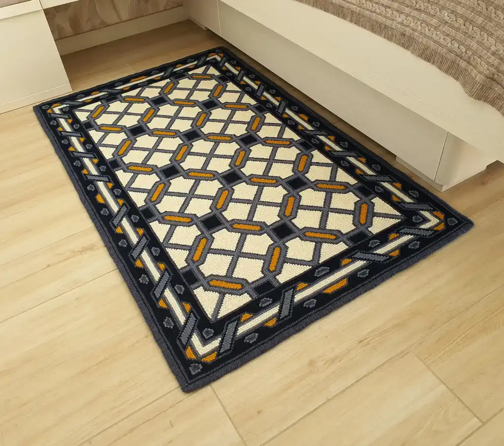 handcrafted wool rug with cross-stitch pattern.