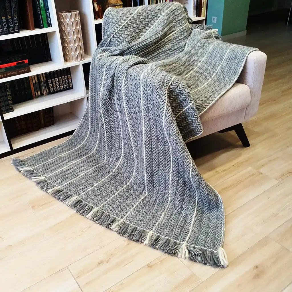 Crochet wool throw blanket in natural tones, handcrafted with traditional techniques.