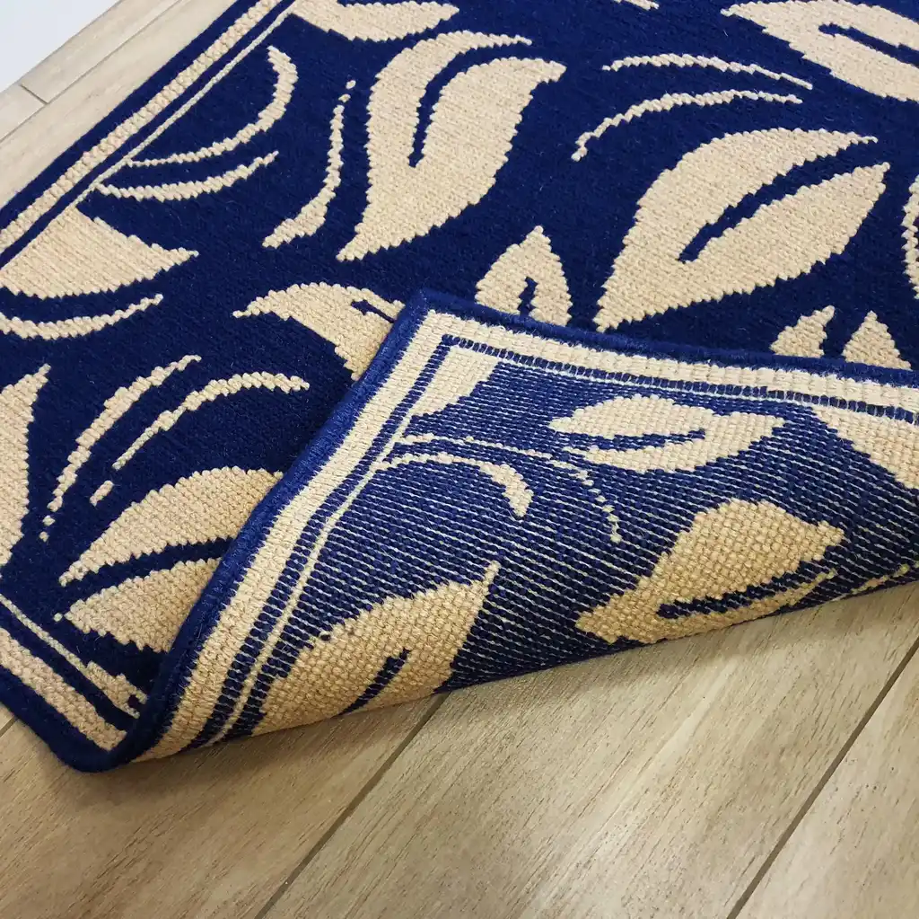 traditional Ukrainian cross-stitch wool rug with geometric patterns in earth tones.