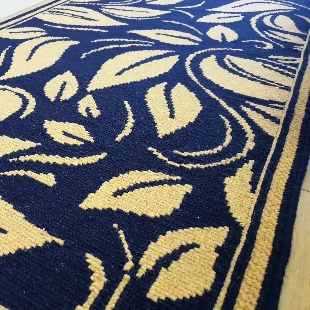 traditional Ukrainian cross-stitch wool rug with geometric patterns in earth tones.