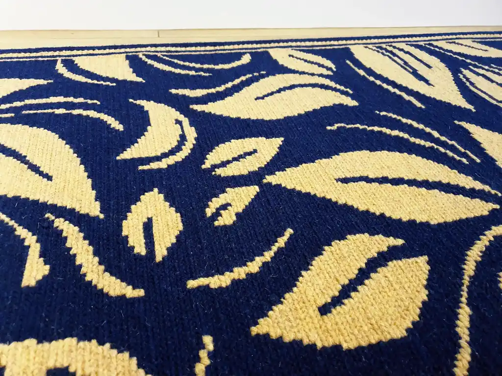 traditional Ukrainian cross-stitch wool rug with geometric patterns in earth tones.