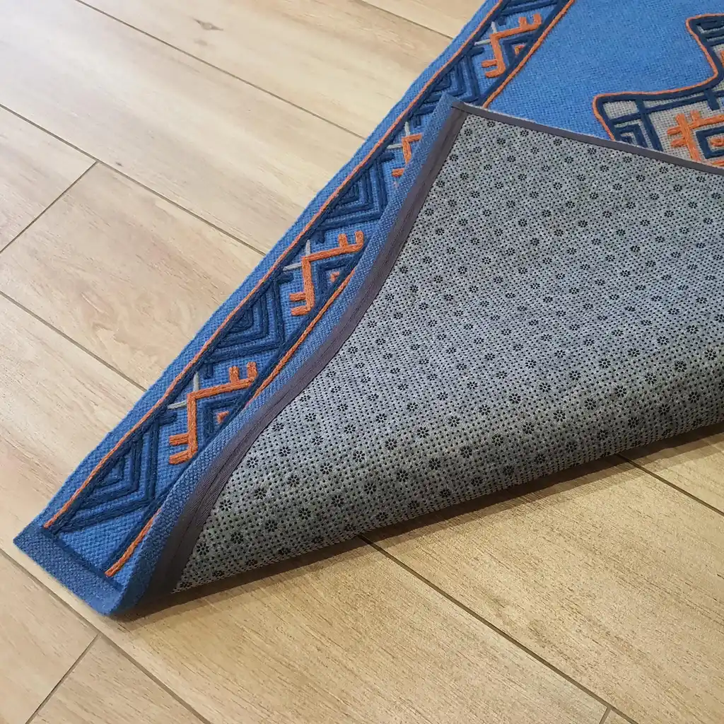 handwoven wool rug with traditional weaving pattern.