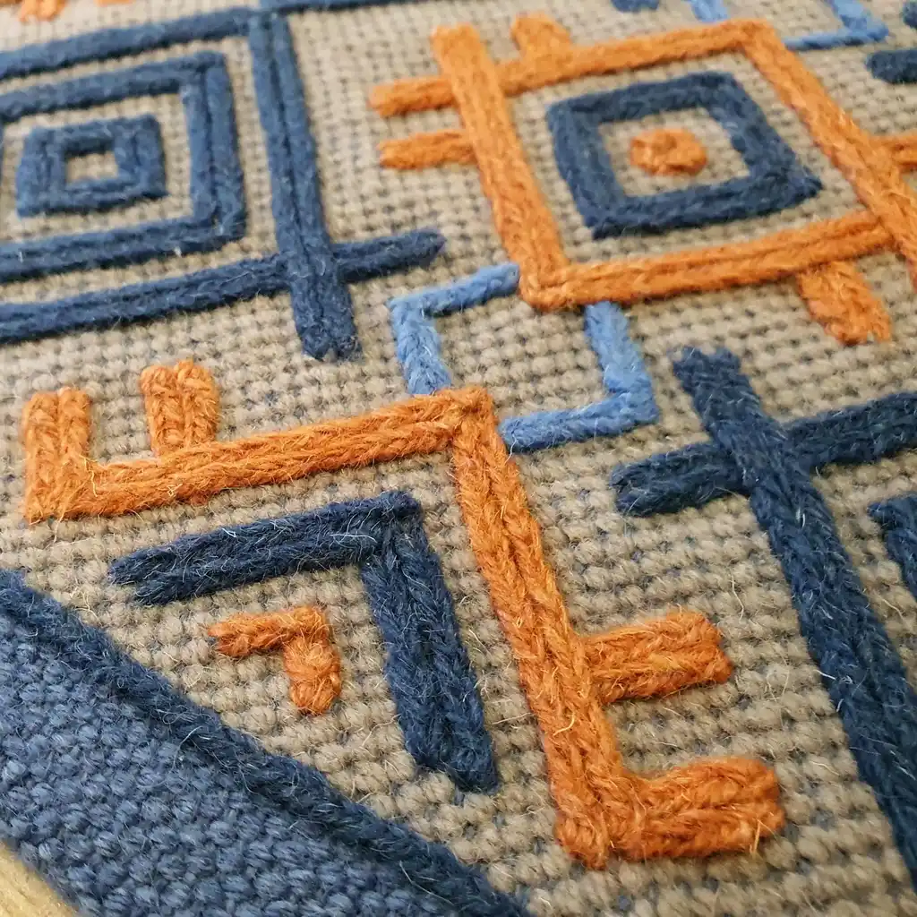 handwoven wool rug with traditional weaving pattern.