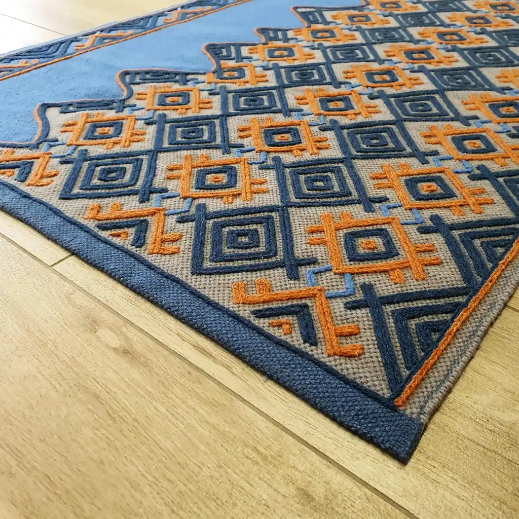 handwoven wool rug with traditional weaving pattern.