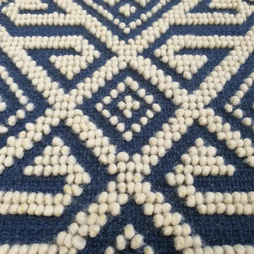 handwoven wool rug featuring traditional Ukrainian weaving techniques.