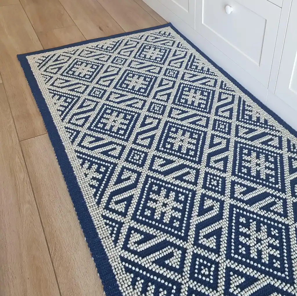 handwoven wool rug featuring traditional Ukrainian weaving techniques.