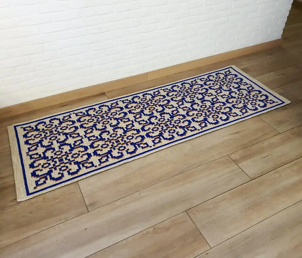 handwoven wool rug with traditional weaving pattern.