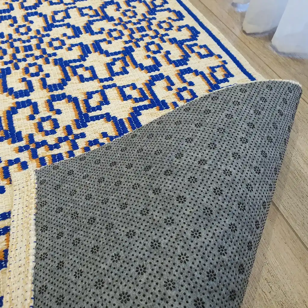 handwoven wool rug with traditional weaving pattern.