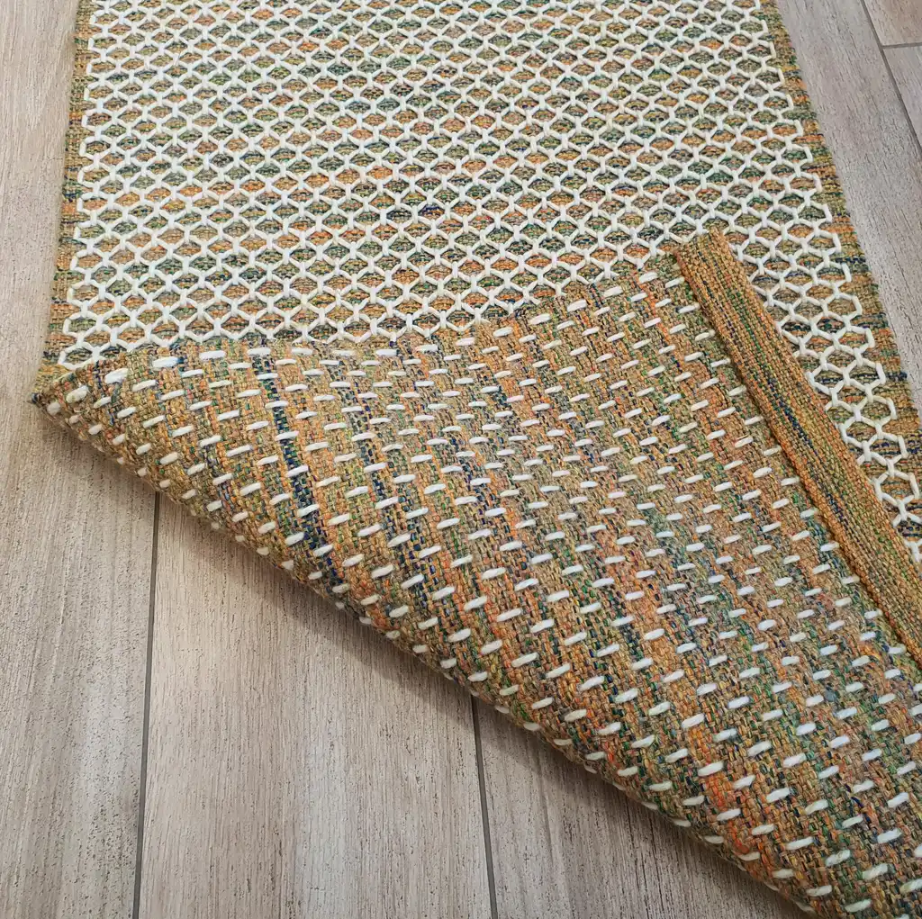 handwoven wool rug traditional weaving technique.