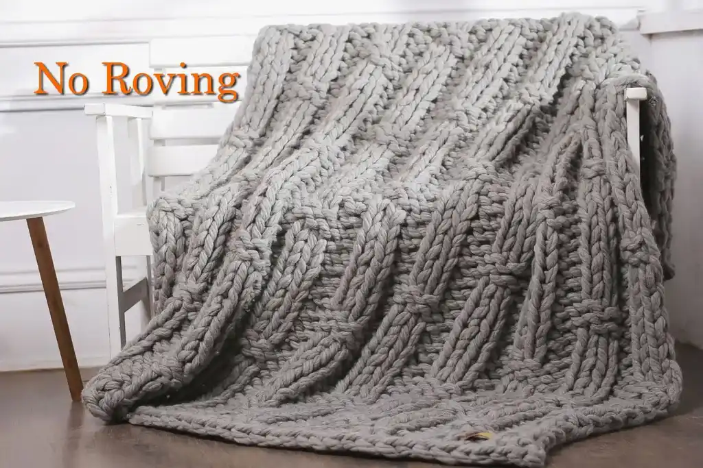 chunky wool knitted blanket in neutral color, handcrafted throw for home comfort.
