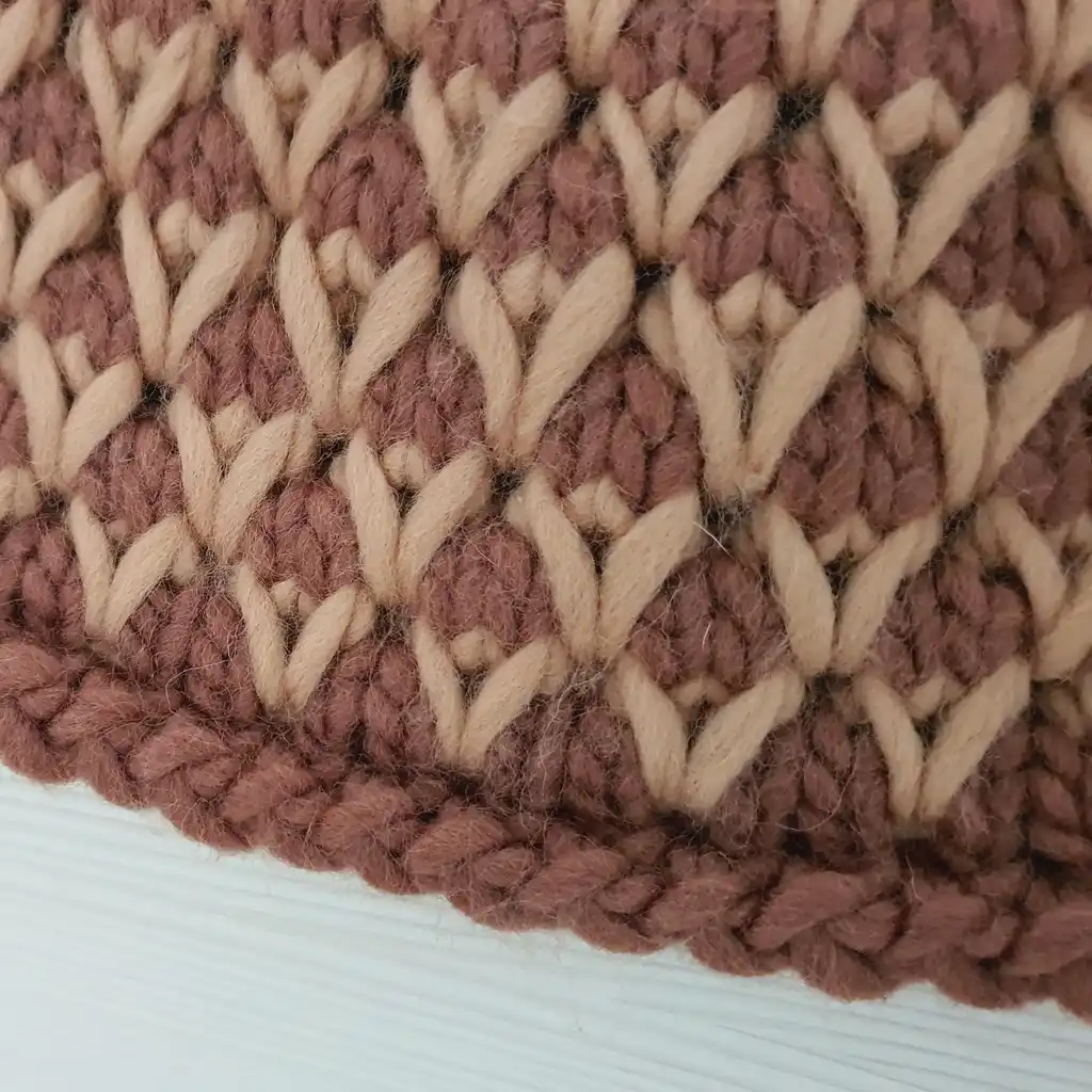 The luxury merino wool knitted throw blanket in elegant design.