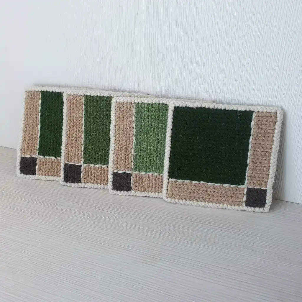 Handmade set of 4 mug pads made of wool and jute with non-skid backing.