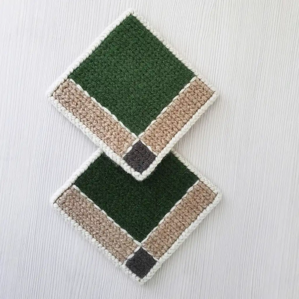 Handmade set of 4 mug pads made of wool and jute with non-skid backing.