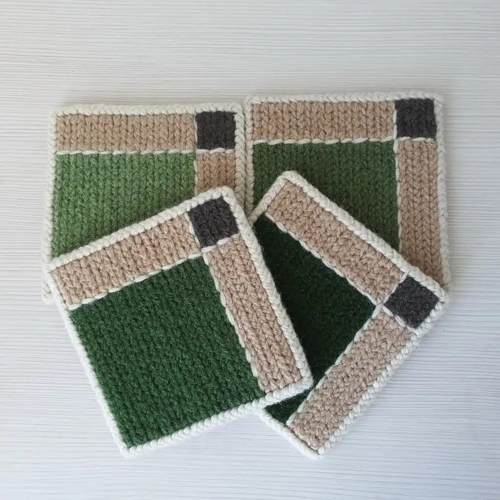 Handmade set of 4 mug pads made of wool and jute with non-skid backing.