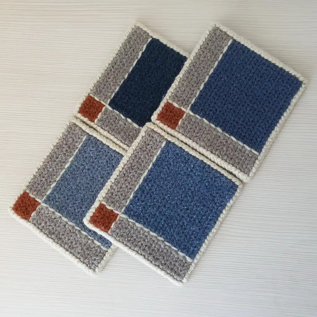 Handmade set of 4 mug pads made of wool and jute with non-skid backing.