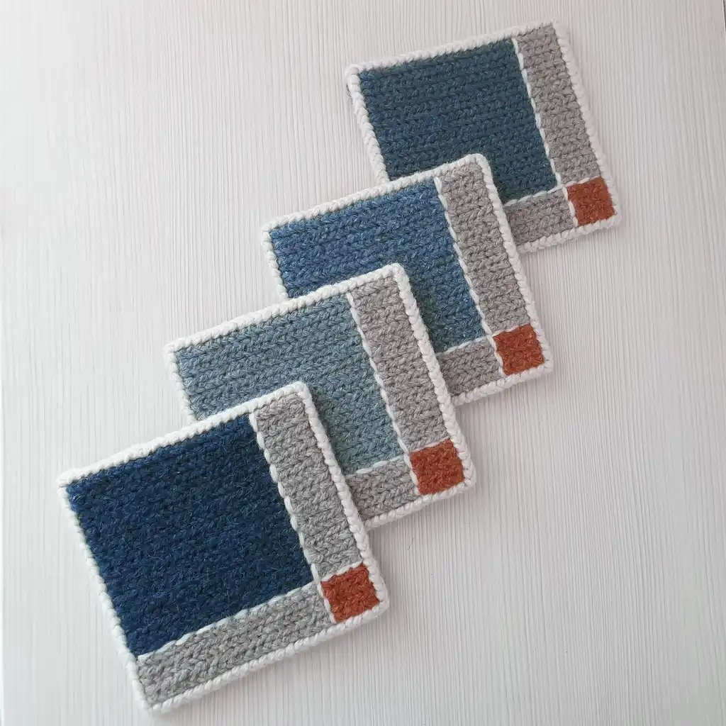 Handmade set of 4 modern mug rugs made of wool and jute with non-skid backing.