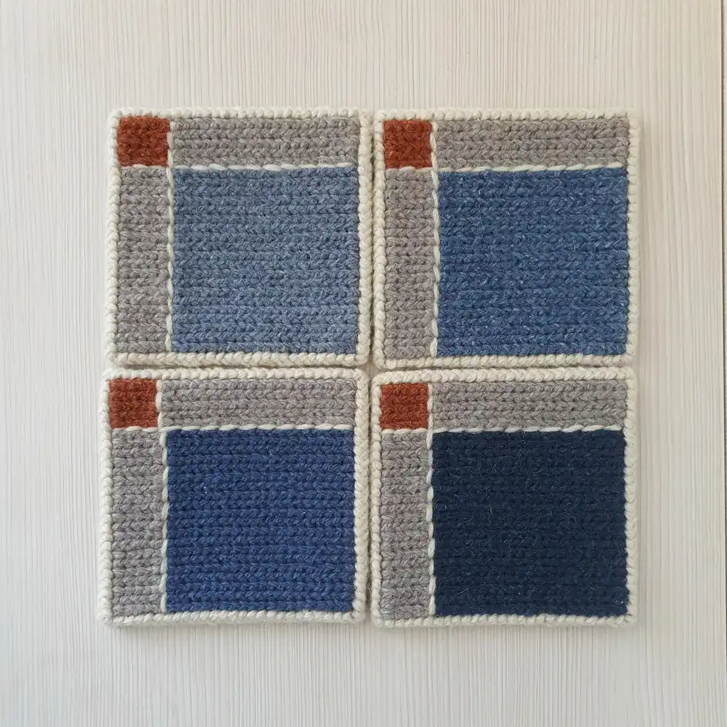 Handmade set of 4 jute embroidered pads with non-slip backing.