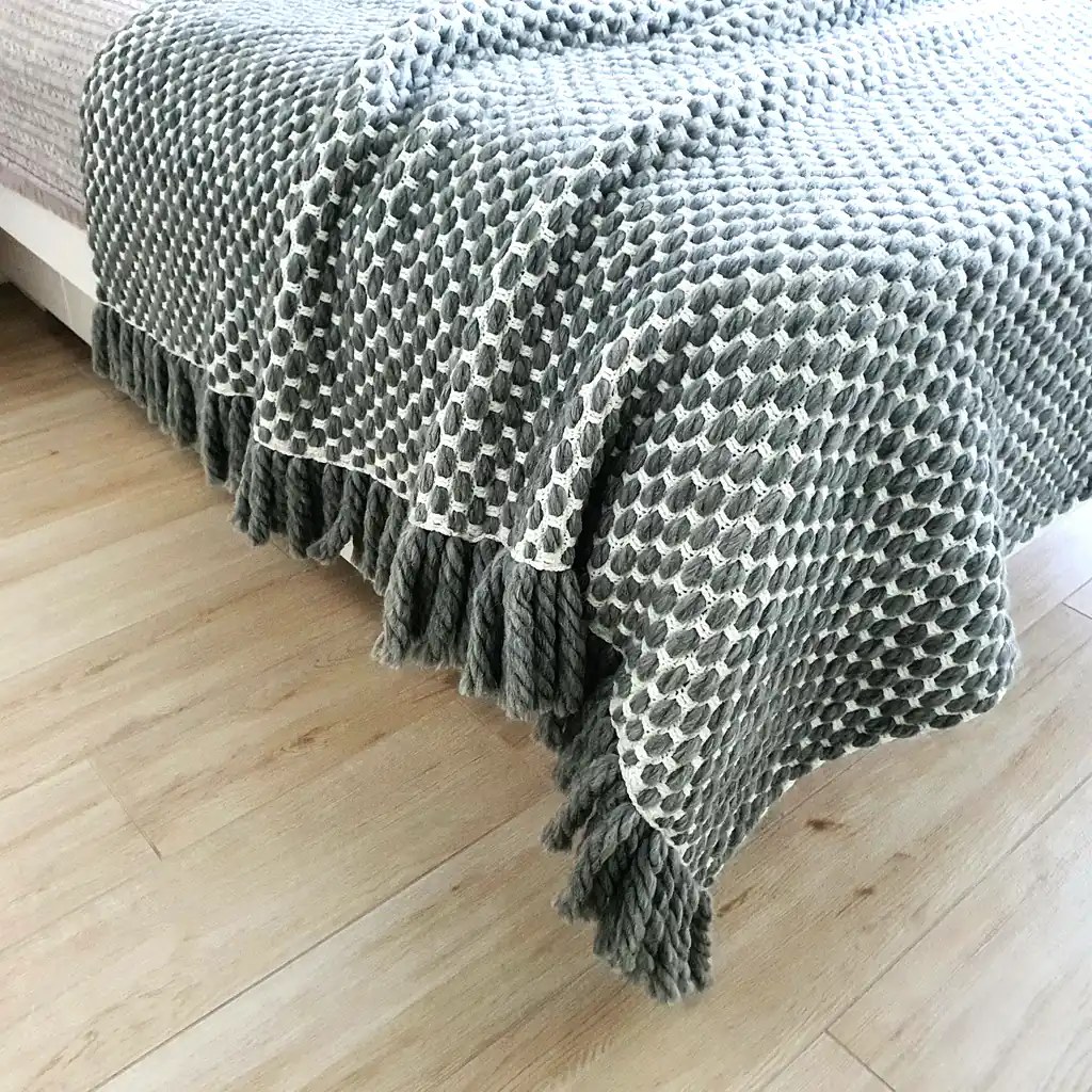 Handmade crocheted gray and white textured wool throw blanket with fringe, double-sided pattern