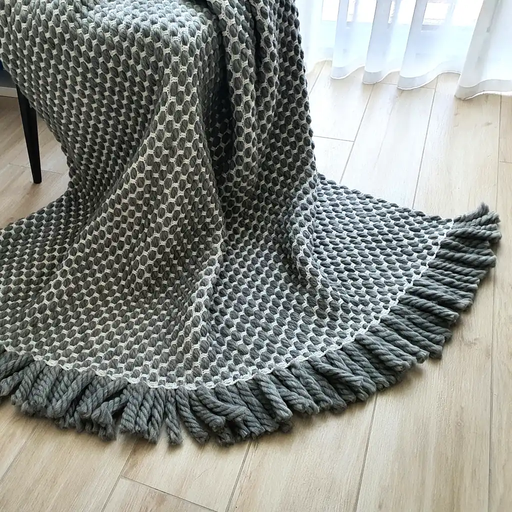 Handmade crocheted gray and white textured wool throw blanket with fringe, double-sided pattern