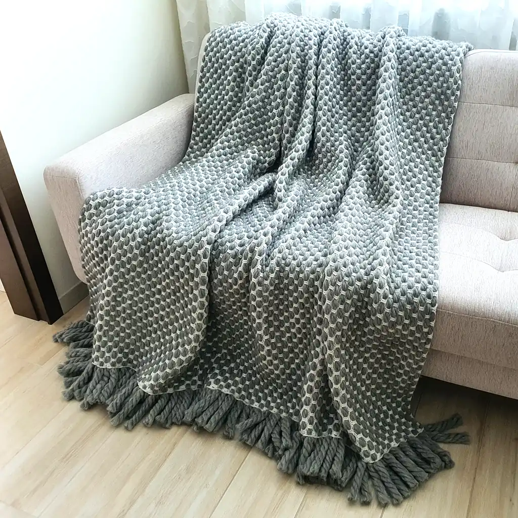 Handmade crocheted gray and white textured wool throw blanket with fringe, double-sided pattern 