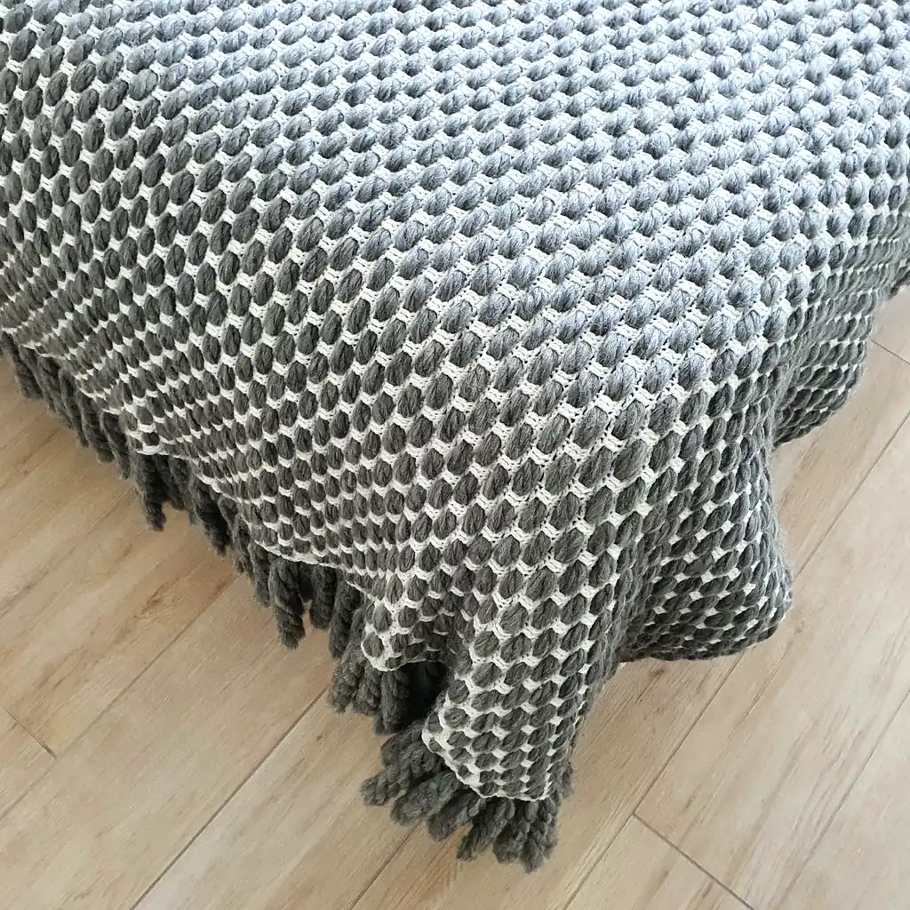 Handmade crocheted gray and white textured wool throw blanket with fringe, double-sided pattern