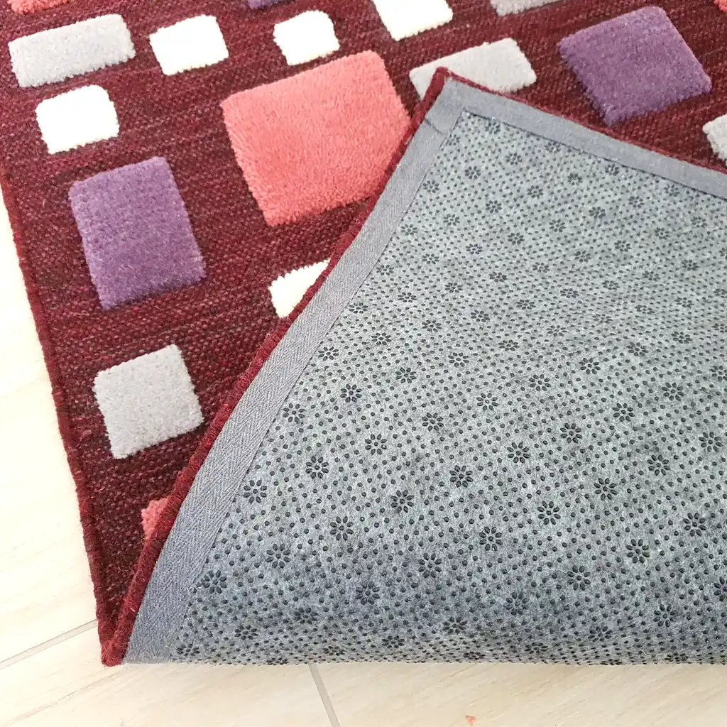 The back of a hand-loomed wool rug demonstrating traditional weaving techniques. Authentic artisan-made carpet from Ukraine, crafted with 3 weeks of daily handwork.