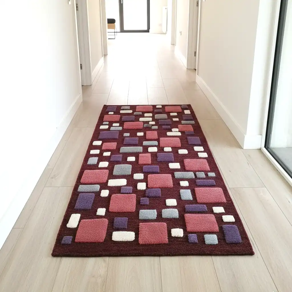 Cozy bedroom decor featuring a deep burgundy handwoven wool rug. Sustainable home accent that adds warmth and artistic character to a Scandi or Boho room.