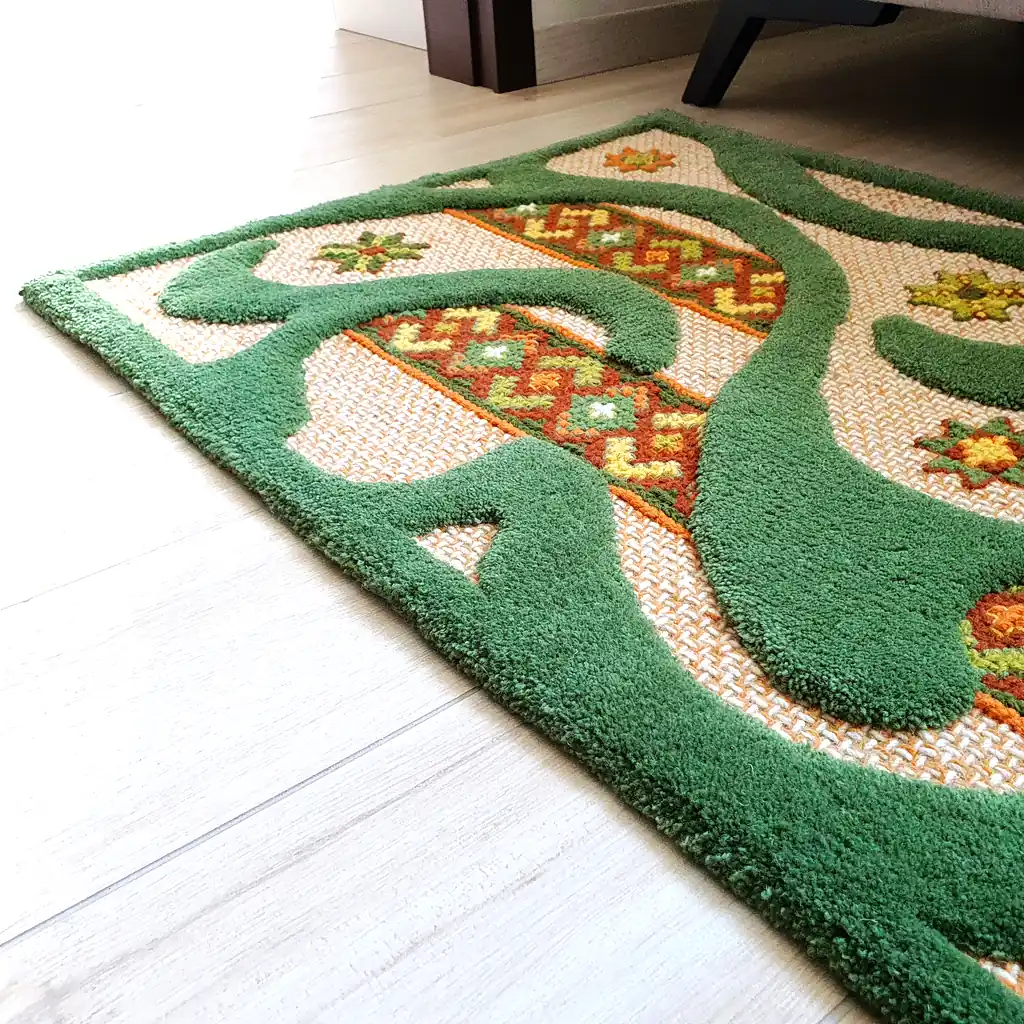 Abstract carpet pattern: swirling green shapes create a 3D effect on a woven background.