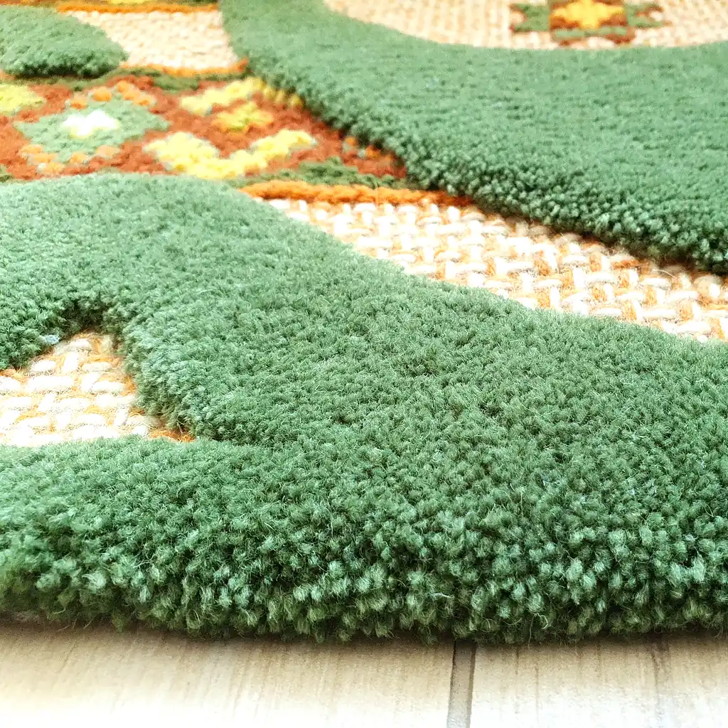 A low-angle shot of the carpet, showing the height of the green voluminous elements.