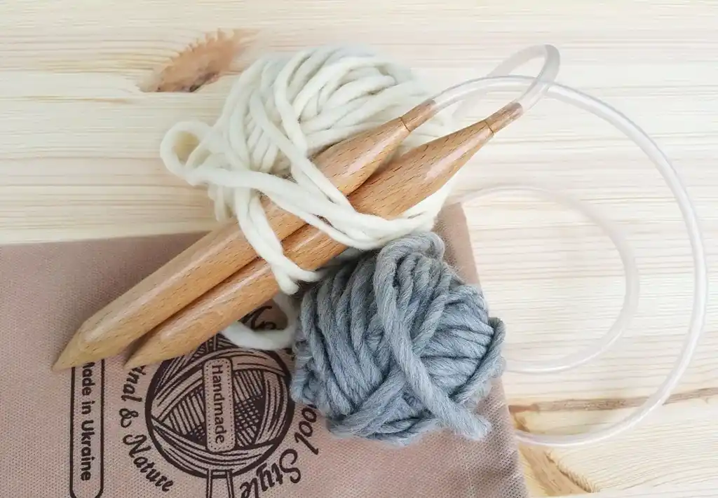 premium beech wood knitting needles 20mm diameter on white background.