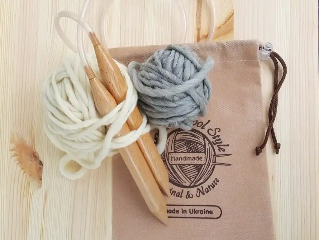 premium beech wood knitting needles 20mm diameter on white background.