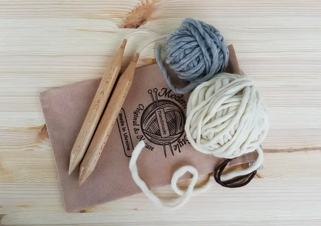 premium beech wood knitting needles 20mm diameter on white background.