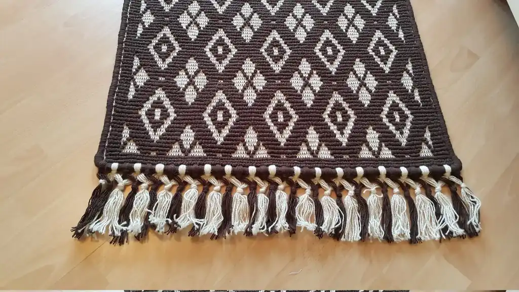 handwoven wool rug featuring traditional weaving technique and natural wool texture.