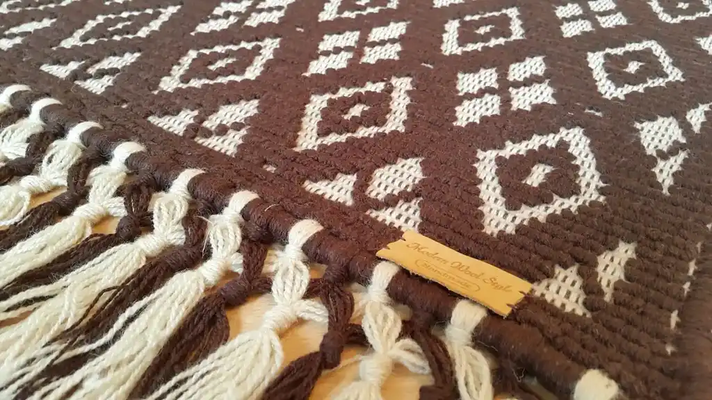 handwoven wool rug featuring traditional weaving technique and natural wool texture.