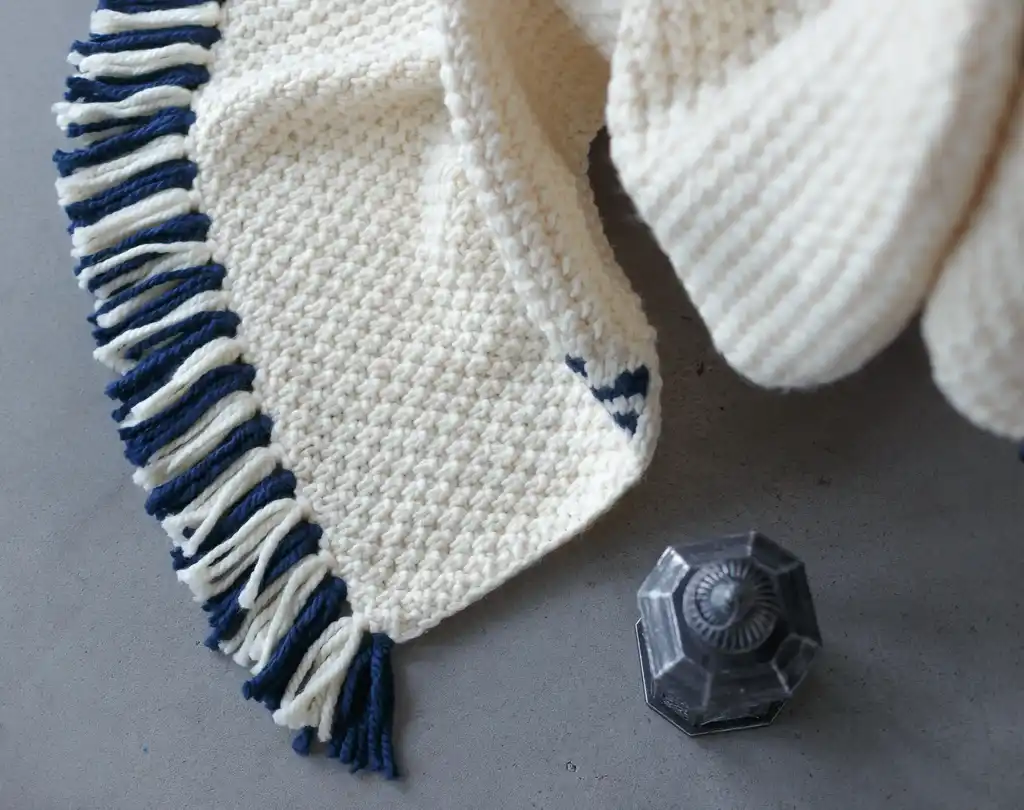 knitted blended wool throw blanket in natural color.