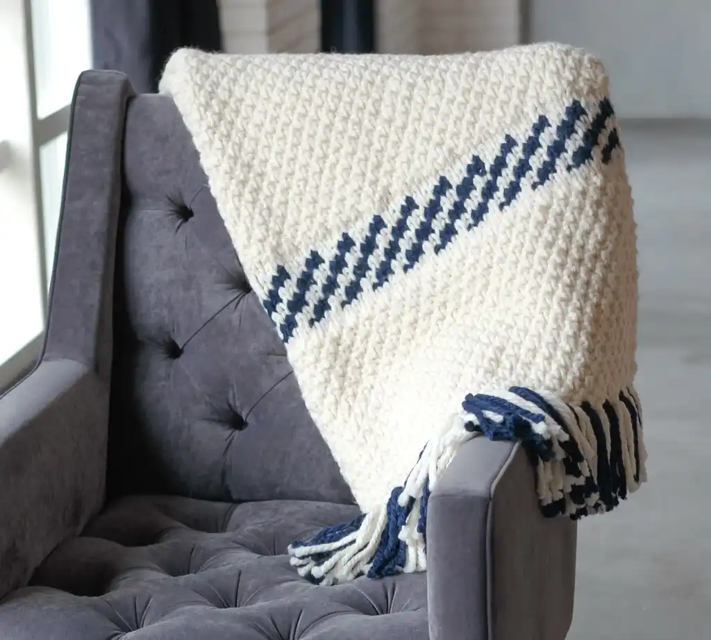 knitted blended wool throw blanket in natural color.
