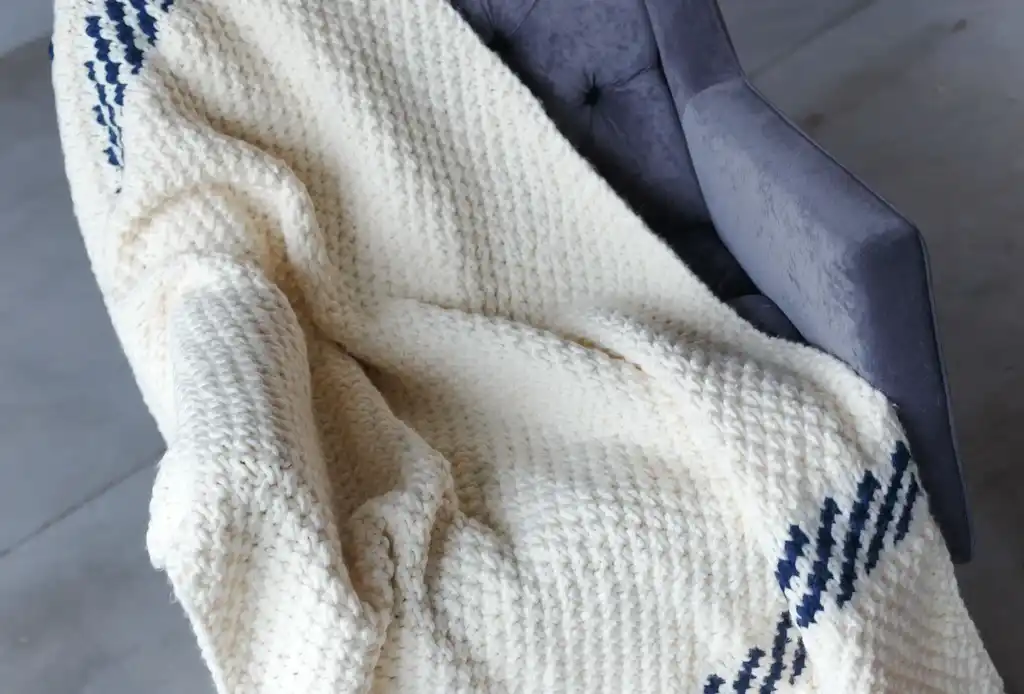 knitted blended wool throw blanket in natural color.