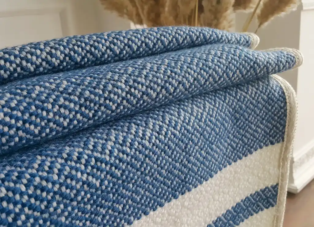 premium merino wool woven throw blanket in neutral colors.
