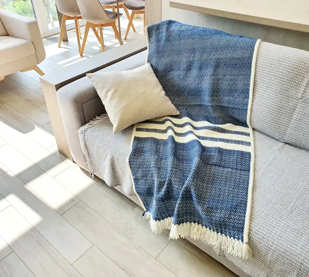 premium merino wool woven throw blanket in neutral colors.
