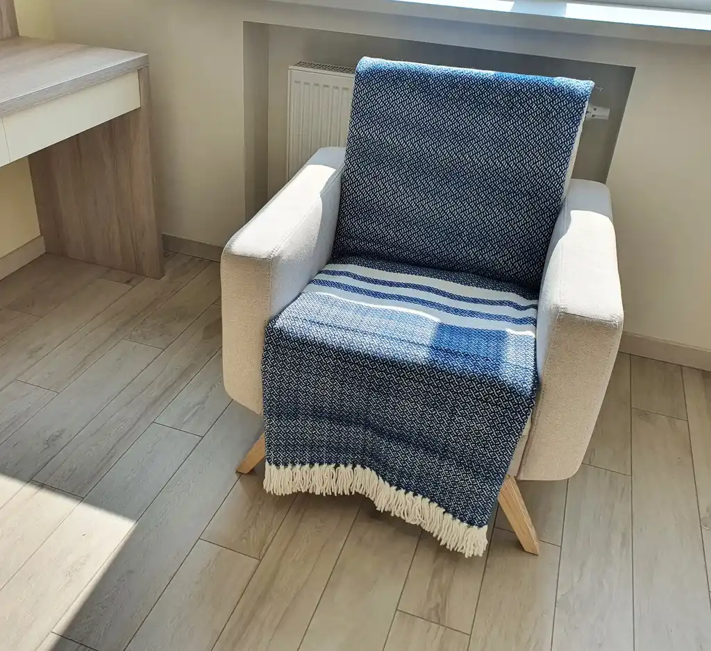premium merino wool woven throw blanket in neutral colors.