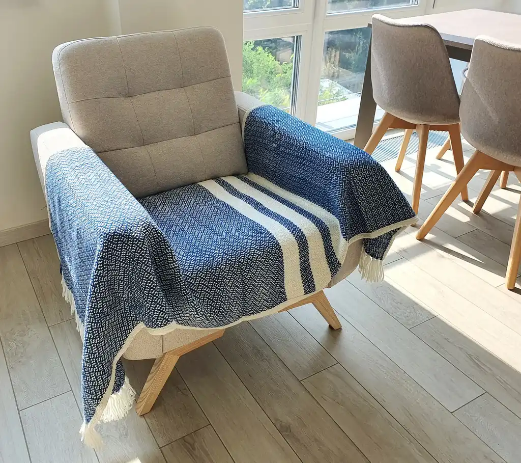 premium merino wool woven throw blanket in neutral colors.