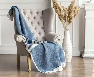premium merino wool woven throw blanket in neutral colors.