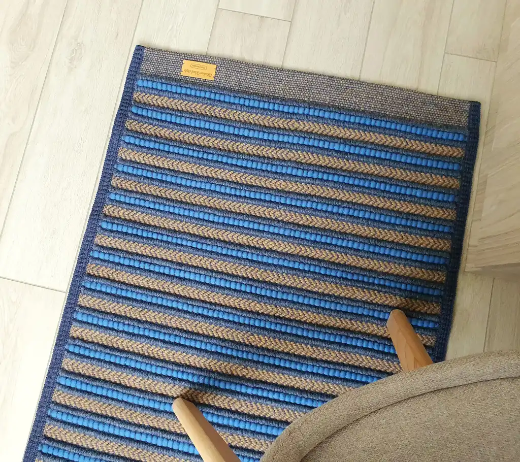 handwoven rug made from natural jute and chunky wool fibers.