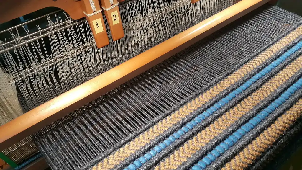 handwoven rug made from natural jute and chunky wool fibers.