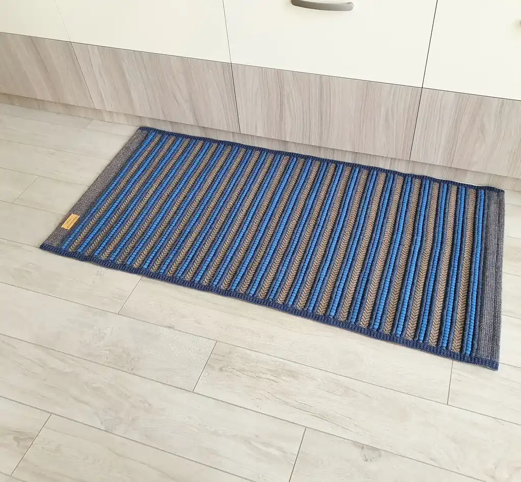 handwoven rug made from natural jute and chunky wool fibers.