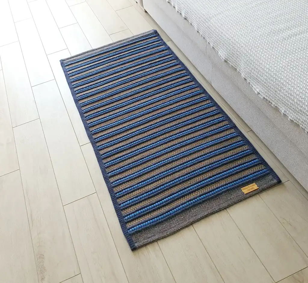 handwoven rug made from natural jute and chunky wool fibers.