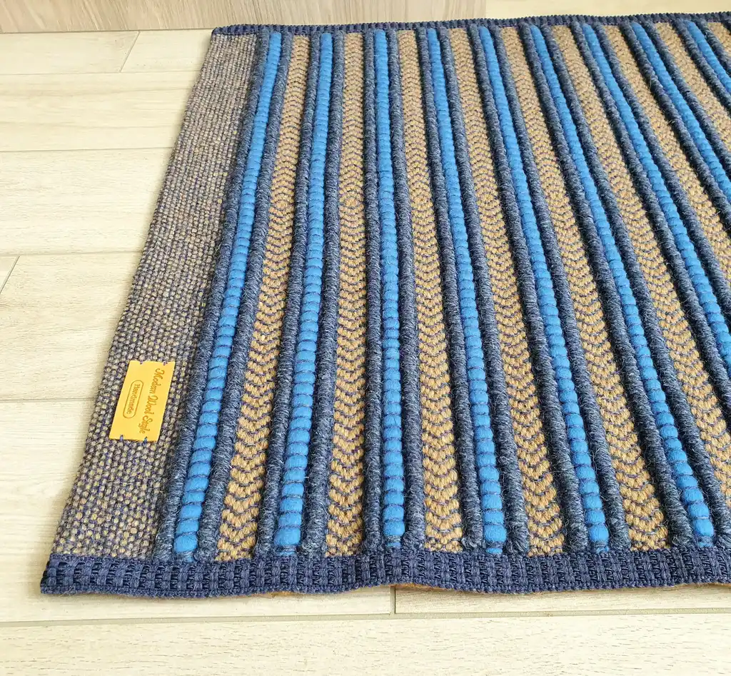 handwoven rug made from natural jute and chunky wool fibers.