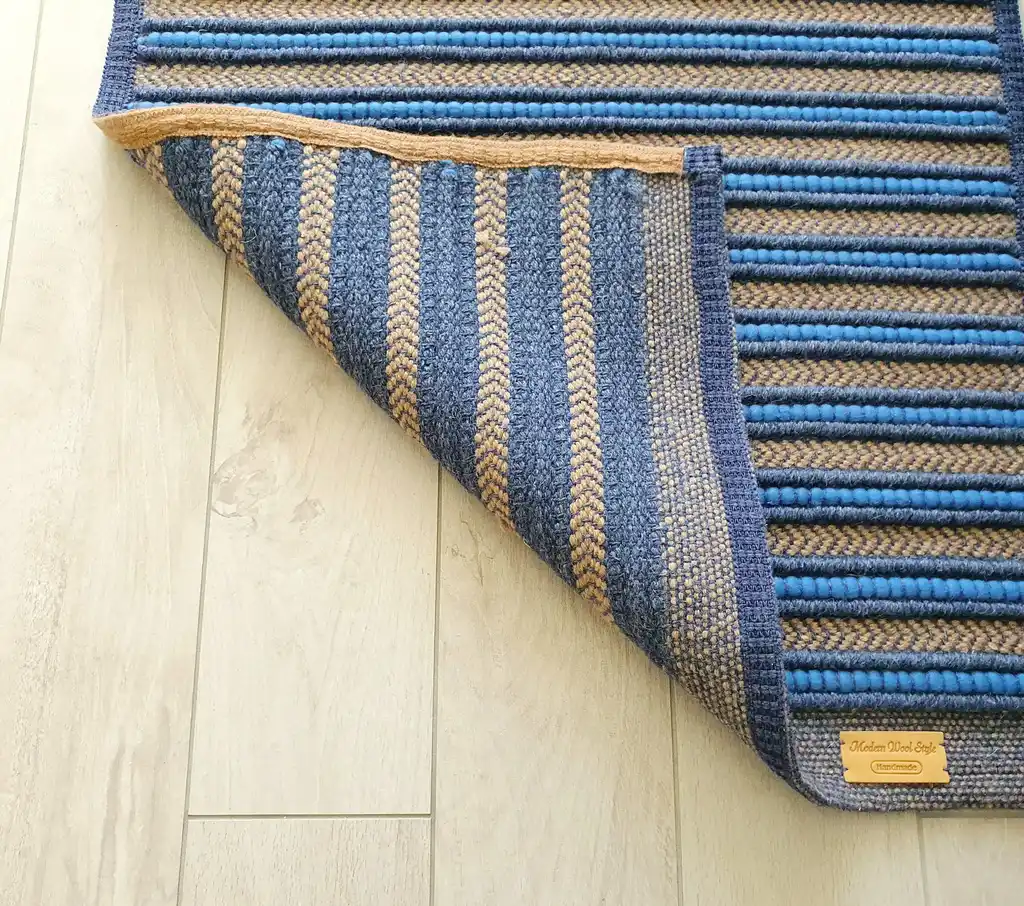 handwoven rug made from natural jute and chunky wool fibers.